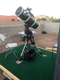 A picture containing object, outdoor, telescope, chair

Description automatically generated
