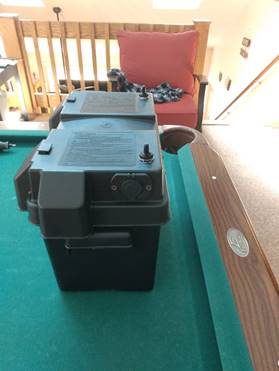 A pool table with a battery

Description automatically generated